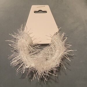 Hair tie made with white eyelash yarn.  Scrunchie  Nwt.